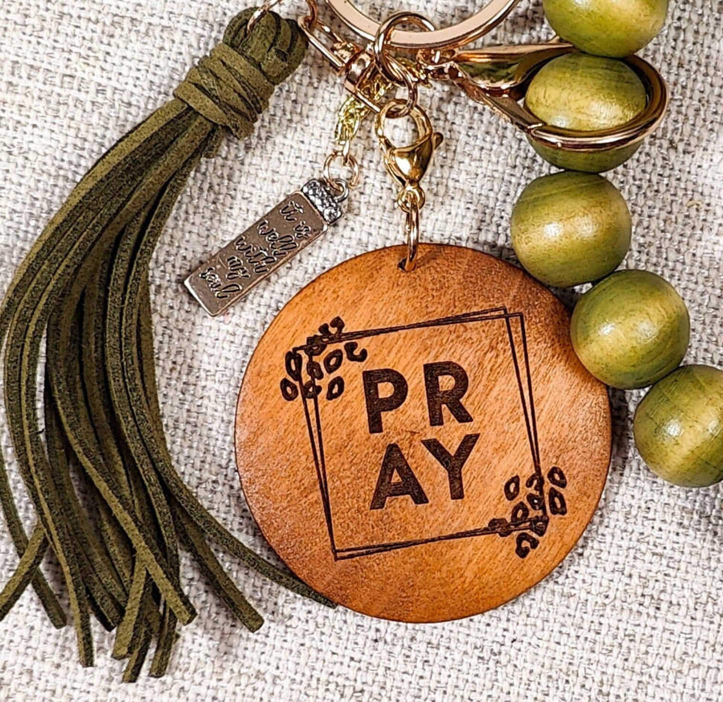 Pray Green Wood Bead Wristlet